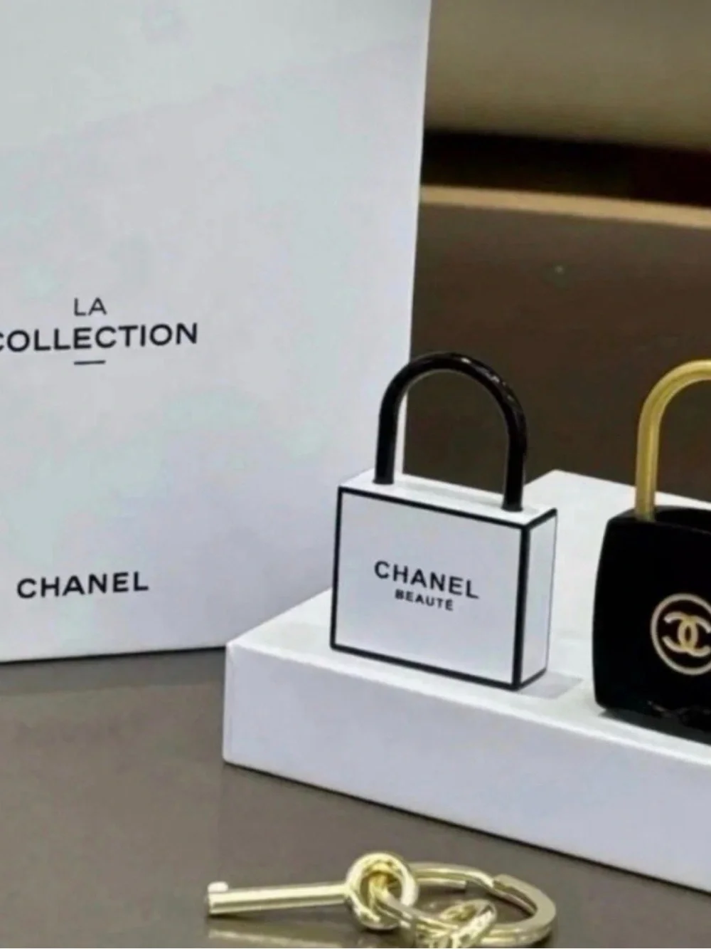 Chanel White and Black Mini Lock Keychain - Picture 1 of 4